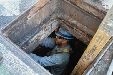 Con Edison worker in underground manhole
