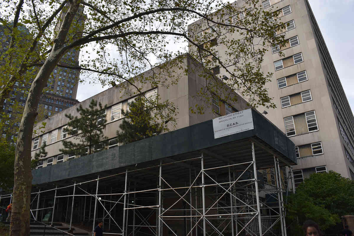 Sidewalk sheds are often left in place for extended periods of time, such as the structures around the Brooklyn Supreme Court Building on Adams Street (pictured), which have stood since 2007.