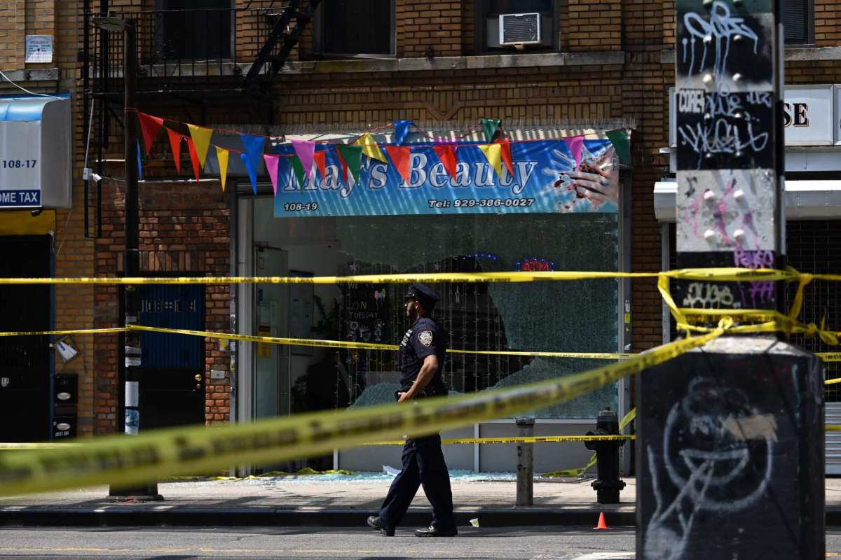 Police officer at Queens shooting spree scene