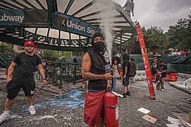 Riot breaks out in Union Square on Friday, Aug. 4. One man sets off fire extinguisher.