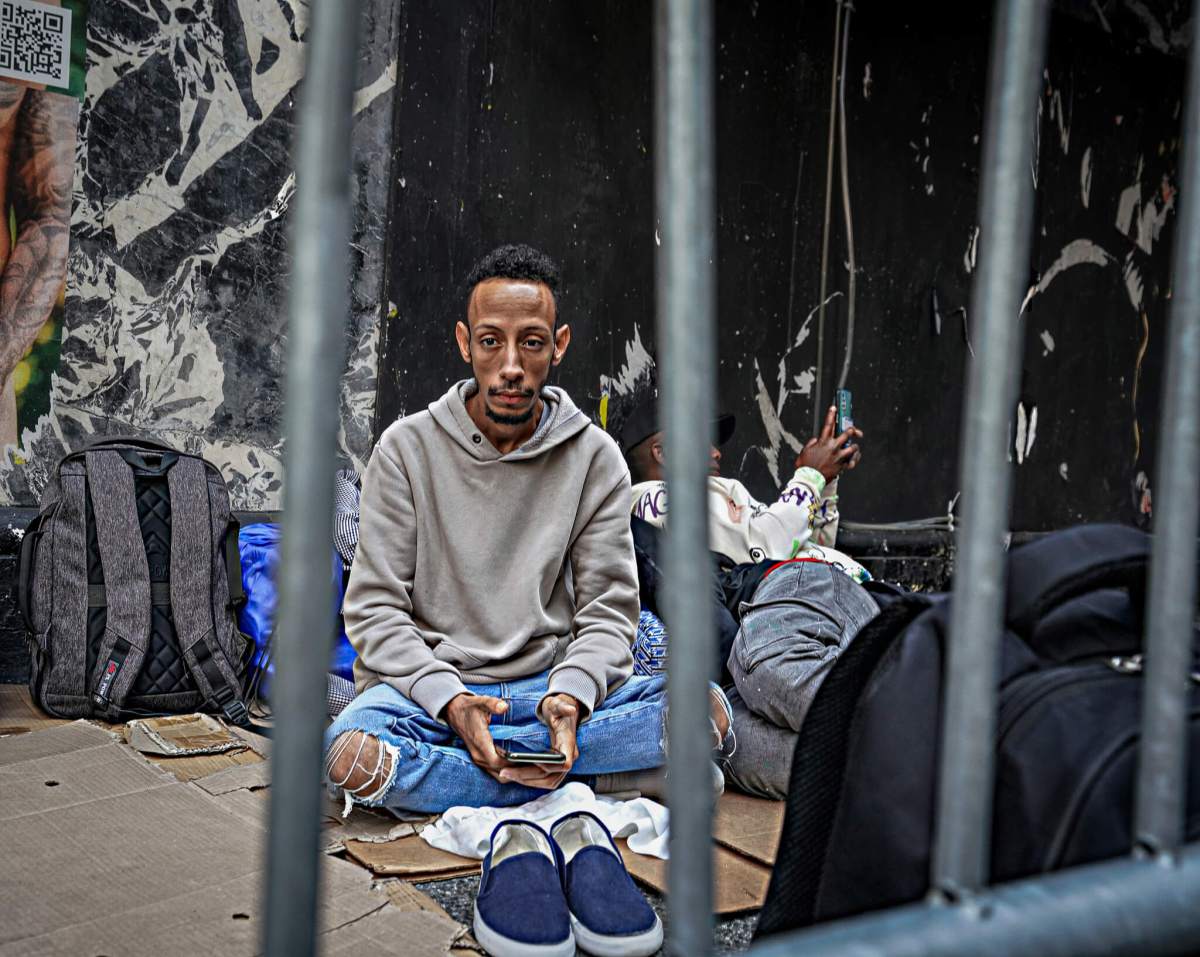 Homeless migrant outside Roosevelt Hotel