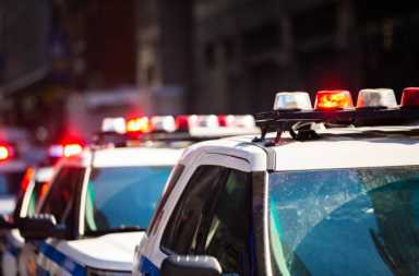New York NYPD Police car with sirens at day on street