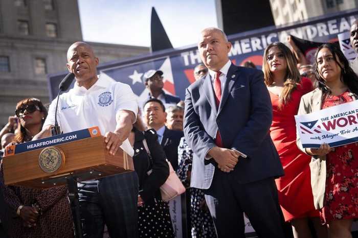 Mayor Eric Adams (left) and Mayor's Office of Immigrant Affairs Commissioner Manuel Castro (right) at a late August rally in Foley Square urging the White House to let migrants work.