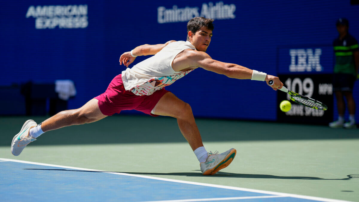 Carlos Alcaraz returns a shot at US Open