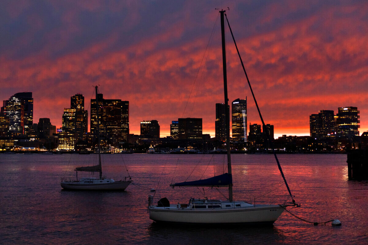 Boston harbor skyline at sunset