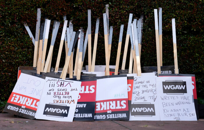 Placards are gathered together at the close of a picket by members of The Writers Guild of America outside Walt Disney Studios, Tuesday, May 2, 2023, in Burbank, Calif