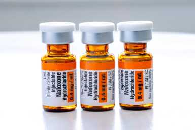 Three bottles in a row of the drug Naloxone