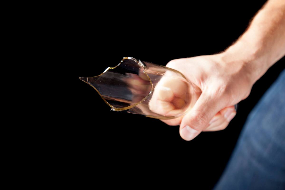 Man holding glass bottle