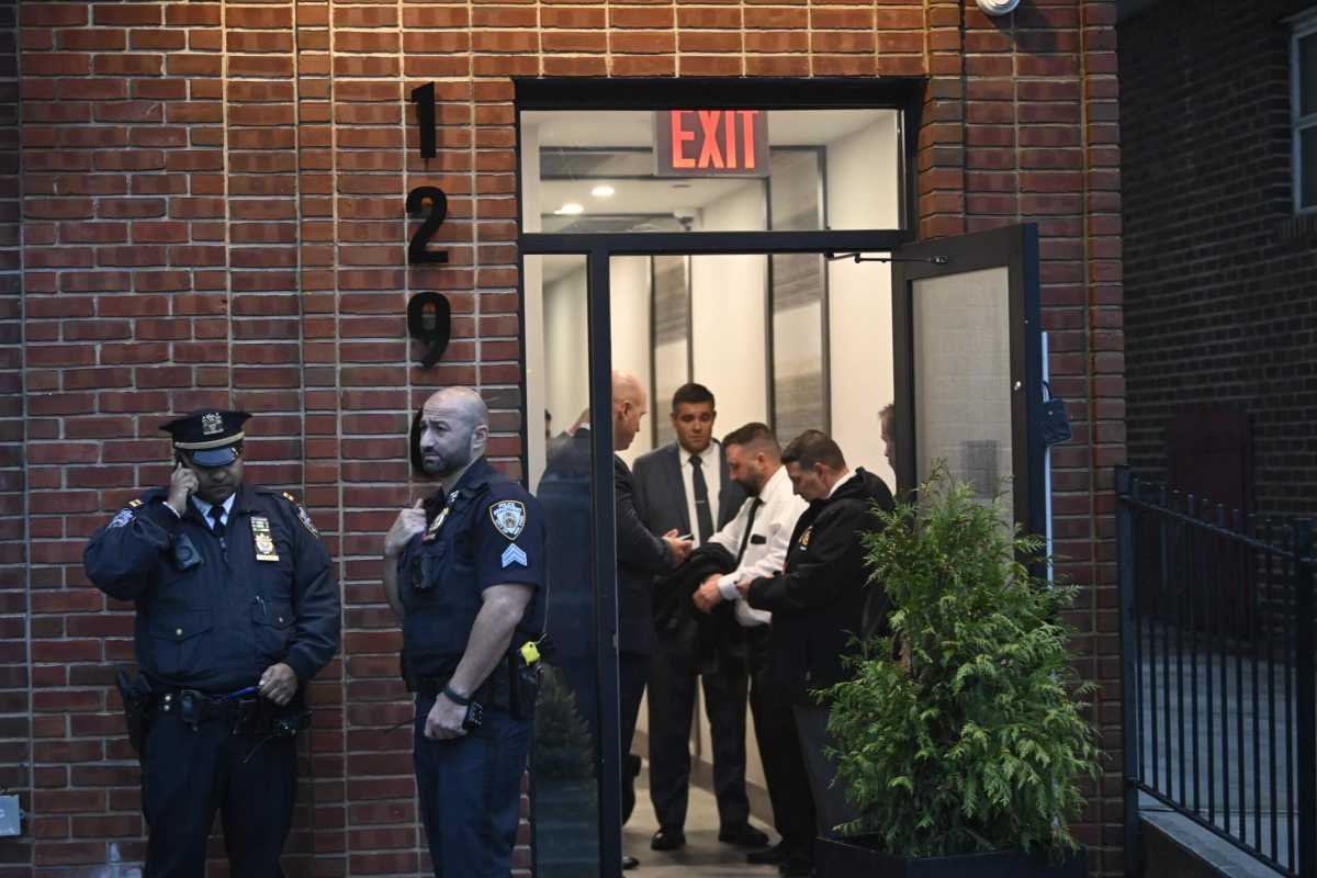 Police outside the Brooklyn residence where a 38-year-old woman and a teenager girl were found dead on Sept. 25, 2023.