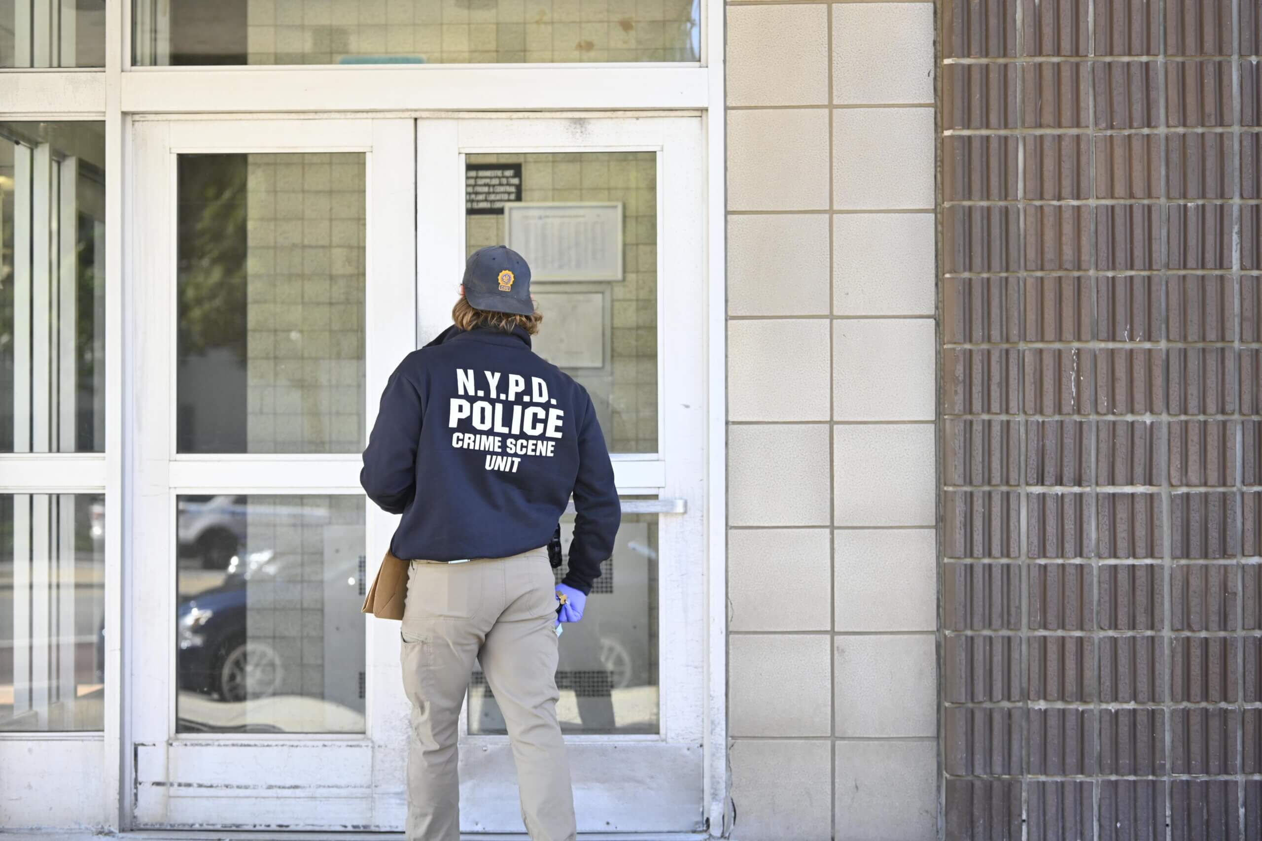 Police crime scene at Brooklyn apartment building where woman was found stabbed
