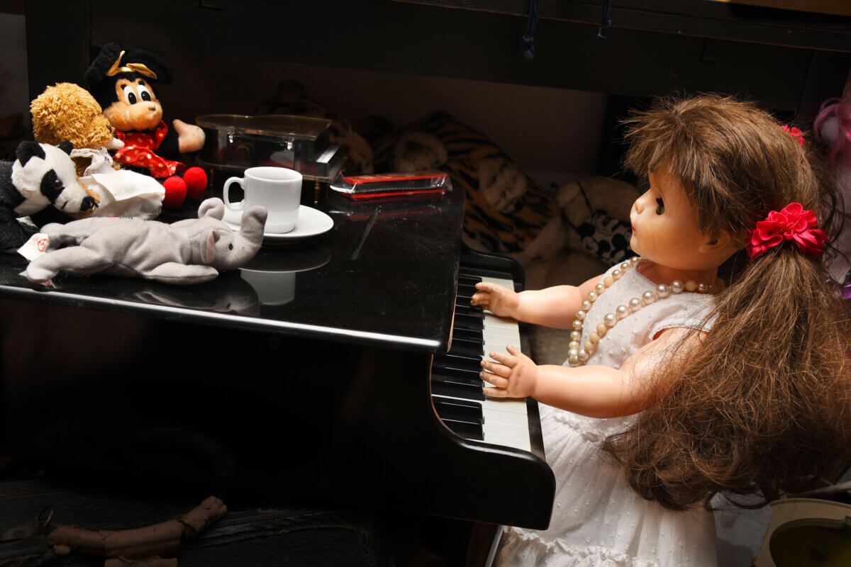 Doll at piano owned by Marcia Resnick