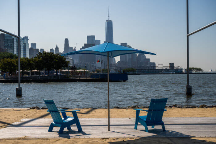 The new public beach at Gansevoort Peninsula features Adirondack chairs for New Yorkers to enjoy the sun while sitting on the waterfront.