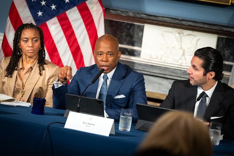 Mayor Eric Adams (center) says his four-day trip to Mexico and South America this week will focus on disuading migrants from coming to New York City