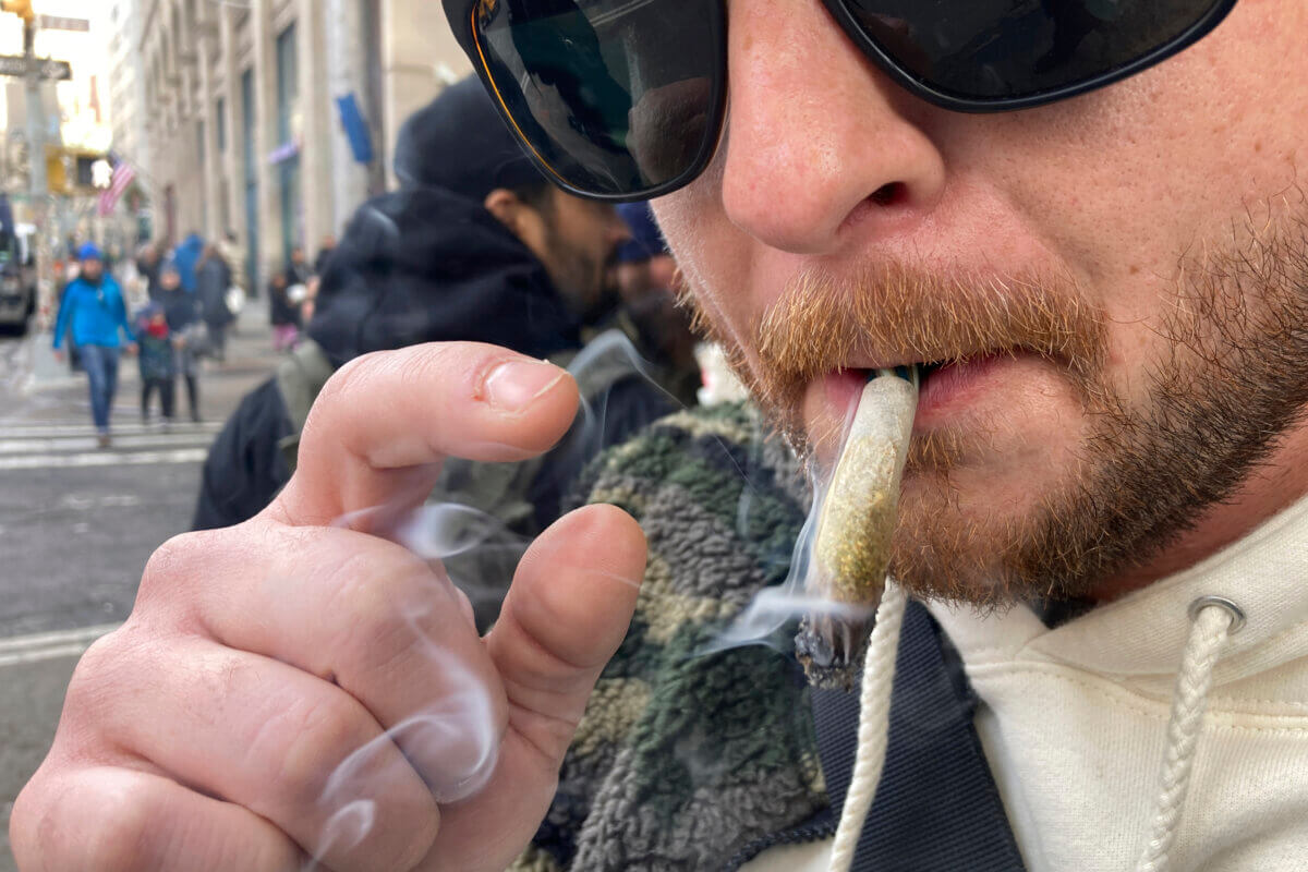 Man smokes marijuana cigarette in Manhattan