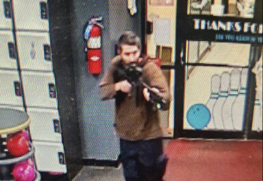 Maine mass shooter holding pointing assault rifle at bowling alley