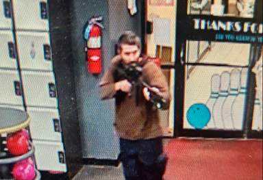 Maine mass shooter holding pointing assault rifle at bowling alley