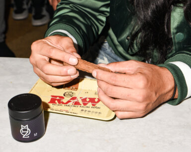 A MOZ employee rolling a joint