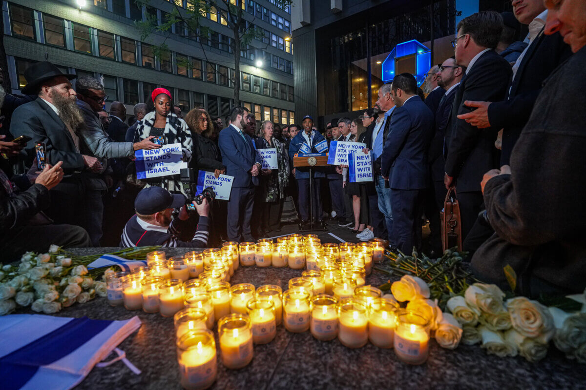 Mayor Eric Adams before star of David in candles at vigil over Israel terrorist attacks