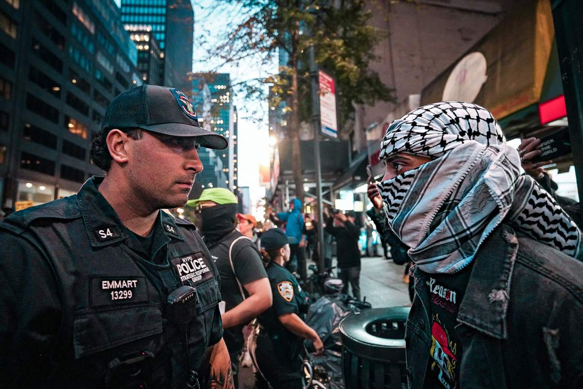 Cops patrol at a protest sparked in the wake of the Israel–Hamas conflict.