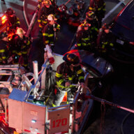 Firefighters pour water on fire in Brooklyn