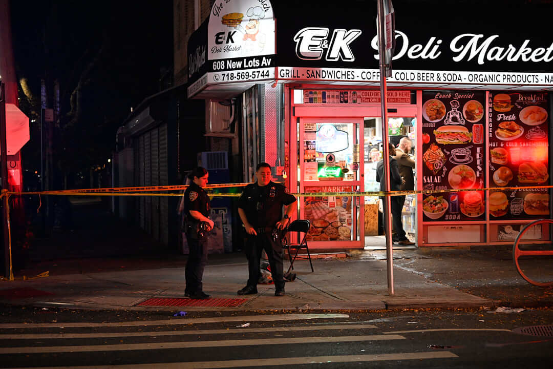 Police outside Brooklyn deli near where man was shot