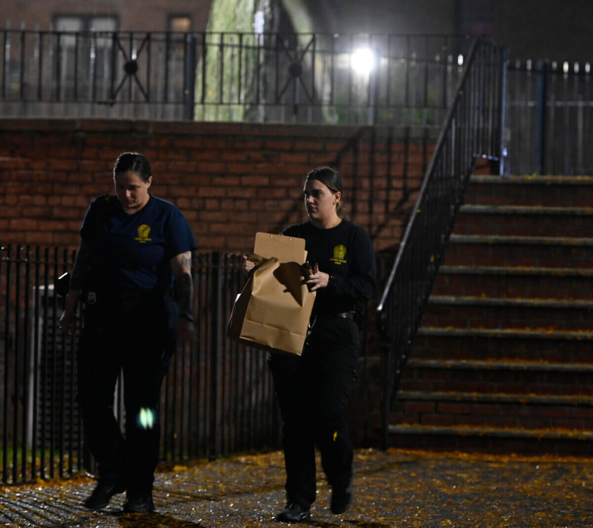 Crime scene detectives with evidence of Brooklyn homicide