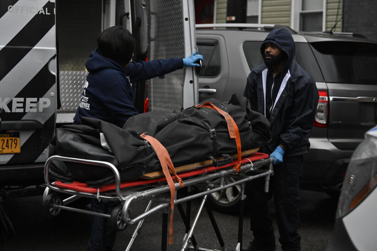 Queens murder suicide victim wheeled out by medical examiner's team