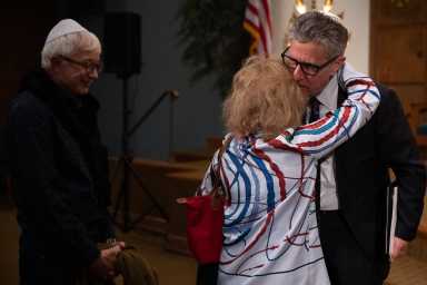 Senior Rabbi Ammiel Hirsch consoles members after a gathering in support of Israel.
