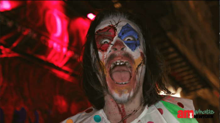 A scare actor dressed as a clown at BloodManor