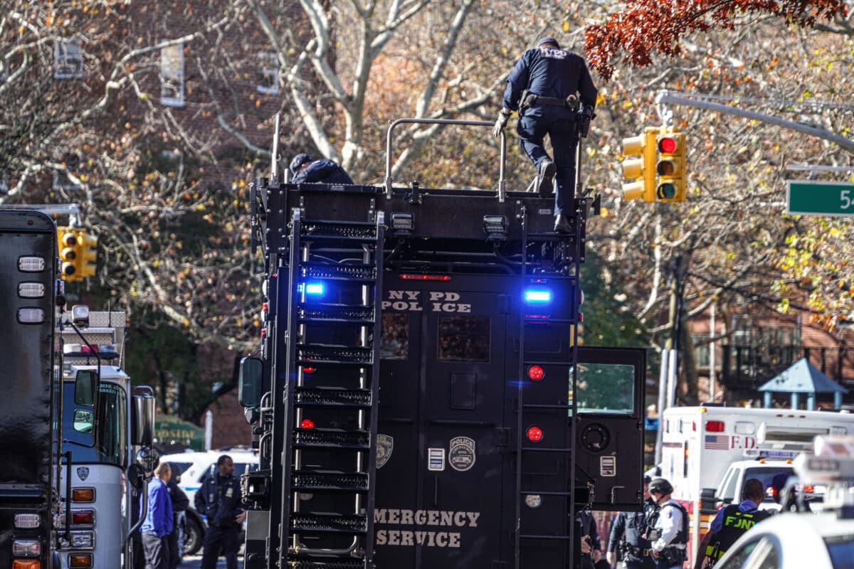 Police on Emergency Service truck in Queens