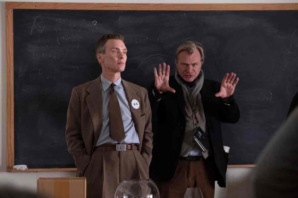 This image released by Universal Pictures shows writer-director-producer Christopher Nolan, right, and actor Cillian Murphy on the set of "Oppenheimer."