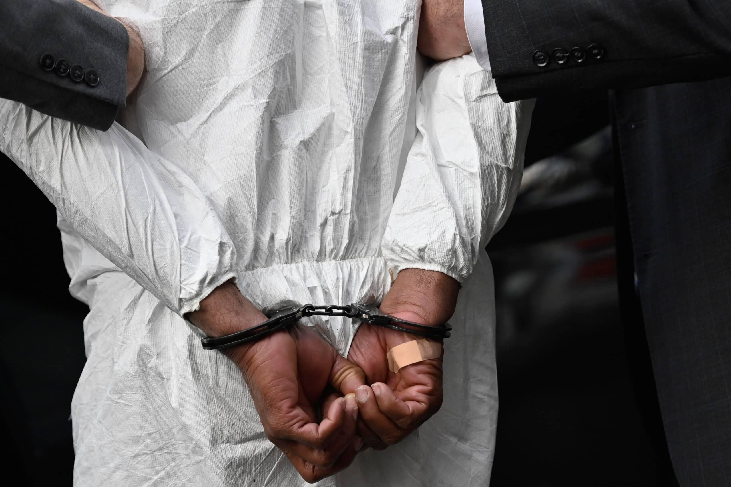 Queens landlord who murdered tenants and girlfriend says he was under 'a lot of pressure' 4 Daniel emerged from the precinct in a Tyvek suit and a band-aid pressed to the inside of his right hand,