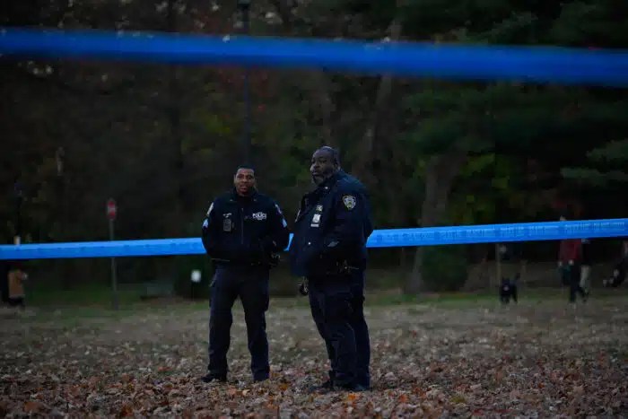 Officers from the 78th Precinct investigate the shooting in Prospect Park on Sunday.