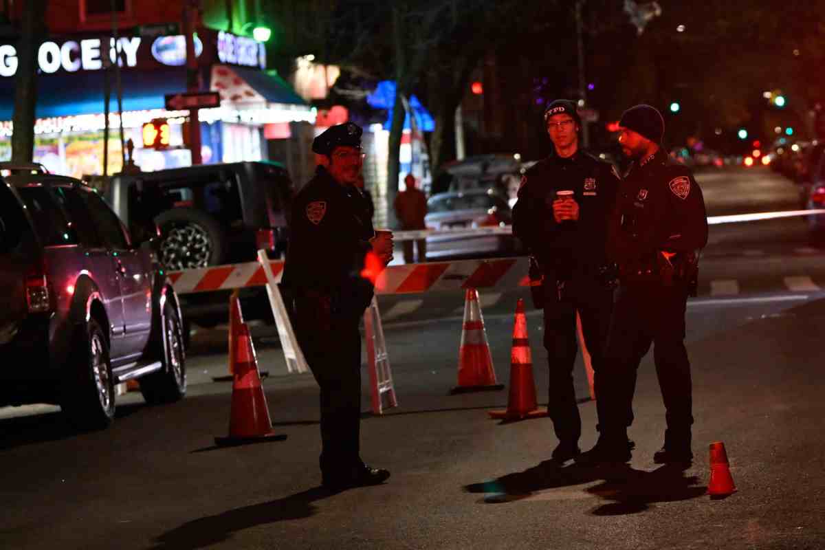 Police search the scene near 2620 Cortelyou Rd. in Brooklyn on Tuesday night.