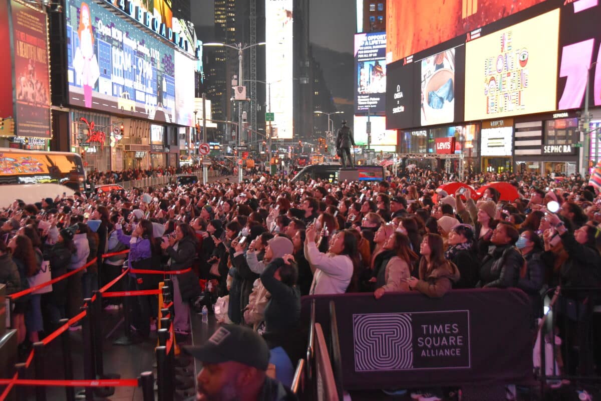 Massive Times Square crowd watches Jung Kook perform