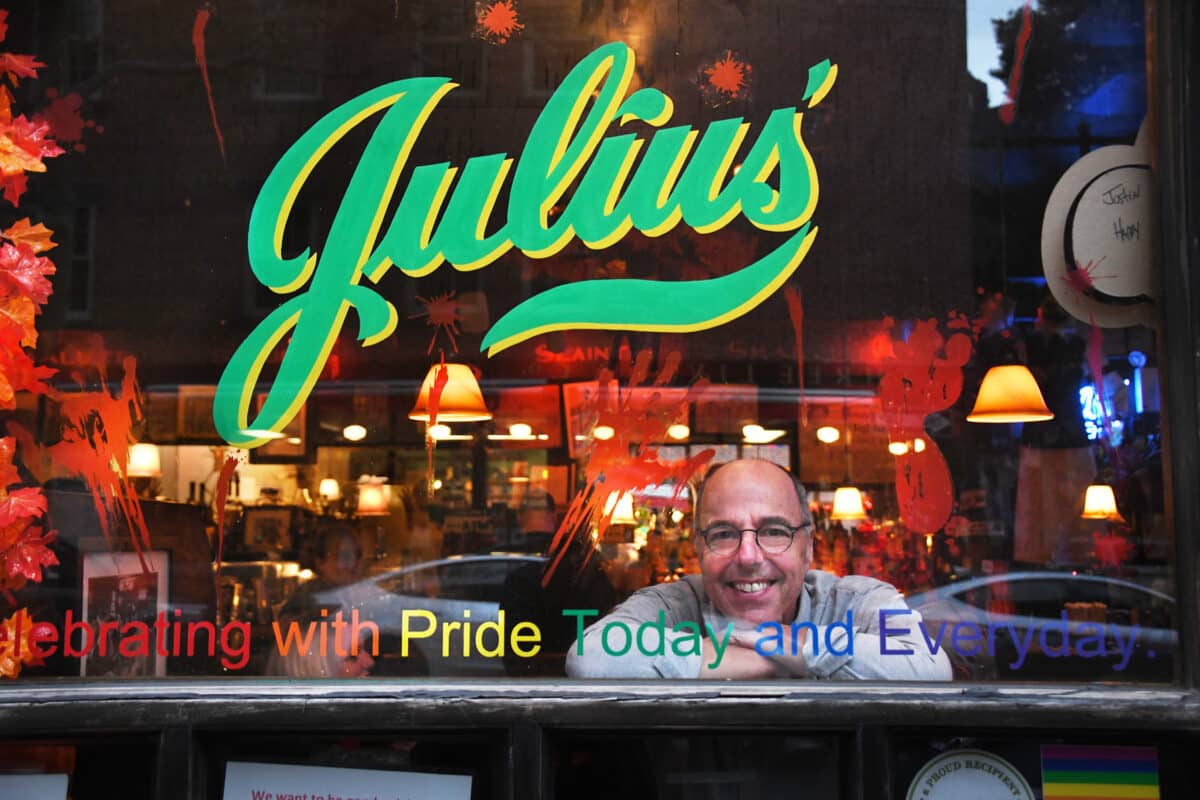 Photographer Dan Root inside Julius' bar, one of the many subjects of his book "New York Bars At Dawn"