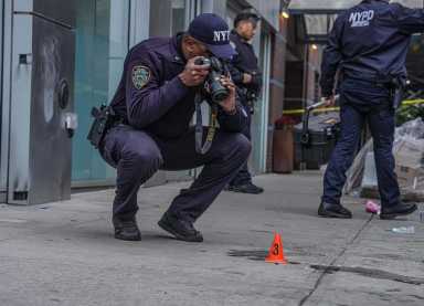 FILE - Police at a Bronx crime scene