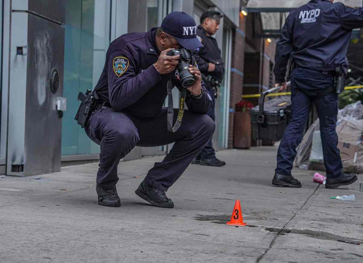 Police at crime scene, Bronx man shot 38 times