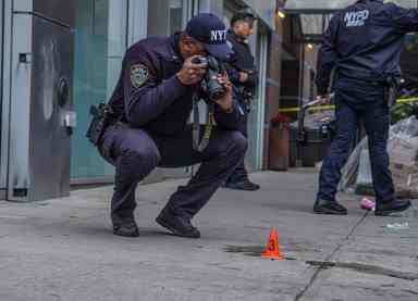 Police at crime scene, Bronx man shot 38 times