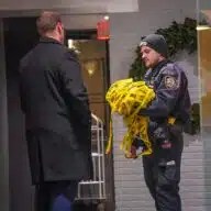 Police in Chelsea at scene where woman was found dead in trash compactor