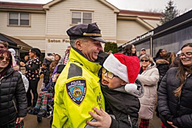 Staten Island student with special needs hugs Highway Patrol officer during Santa Claus visit
