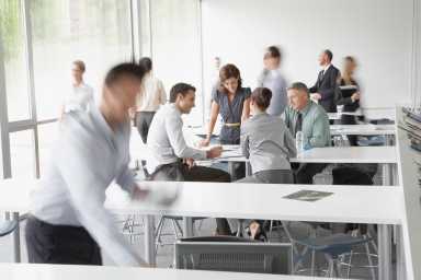Businesspeople working in corporate training facility