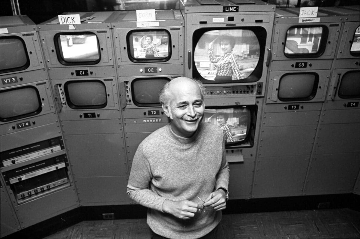 Norman Lear standing in front of camera monitors in 1975