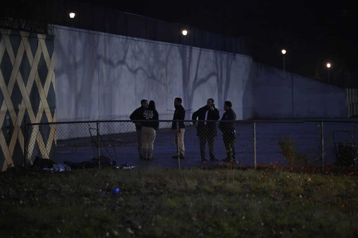 Crime scene detectives near the crime scene in Highland Park