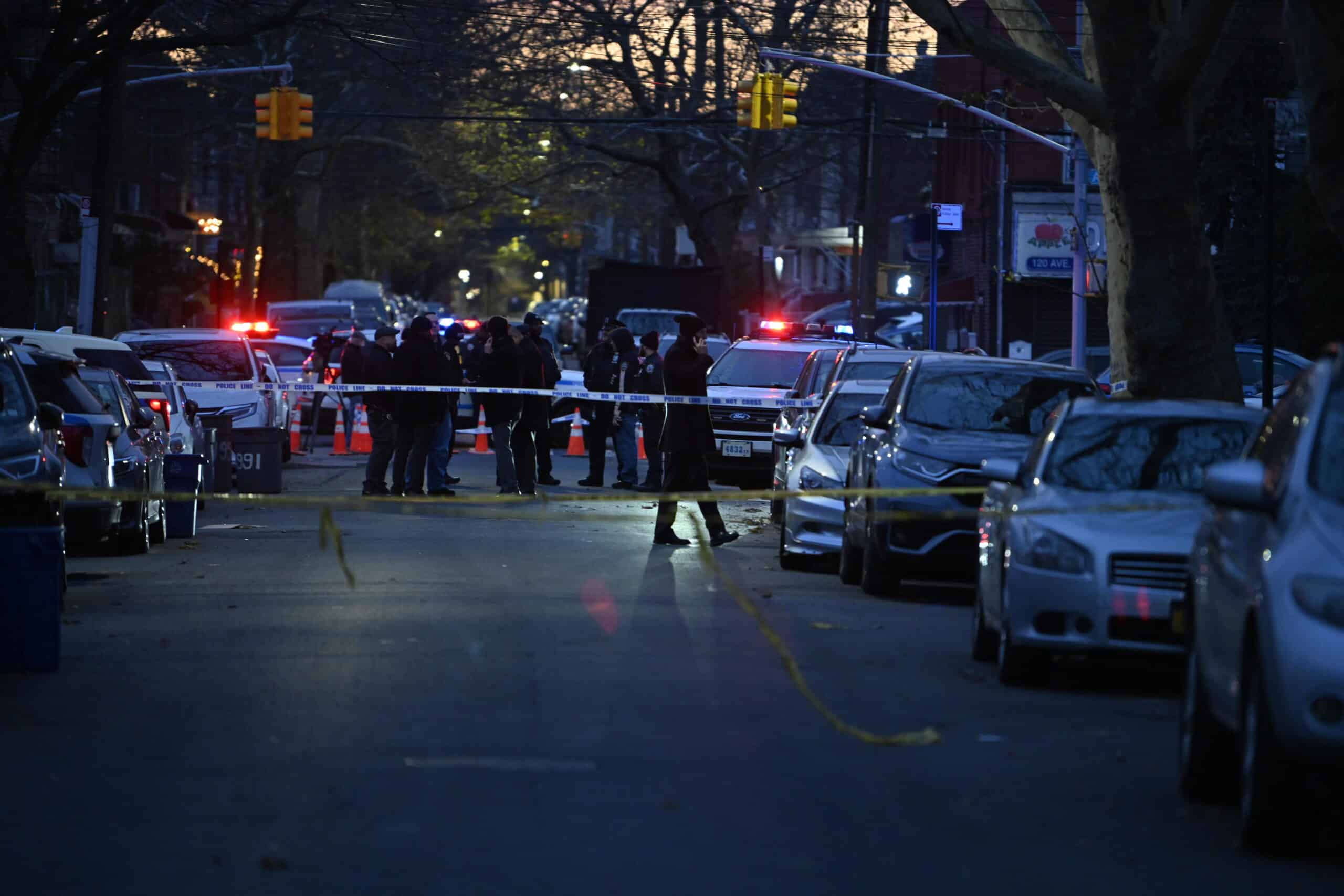 Police investigate the scene of the bloody attack near 1968 W. 9th St. in Brooklyn on Thursday.