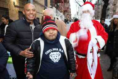 Yankee great Mariano Rivera with Santa Claus and children in Inwood