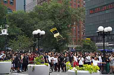 Chair goes flying in dramatic photo from Union Square riot in August 2023