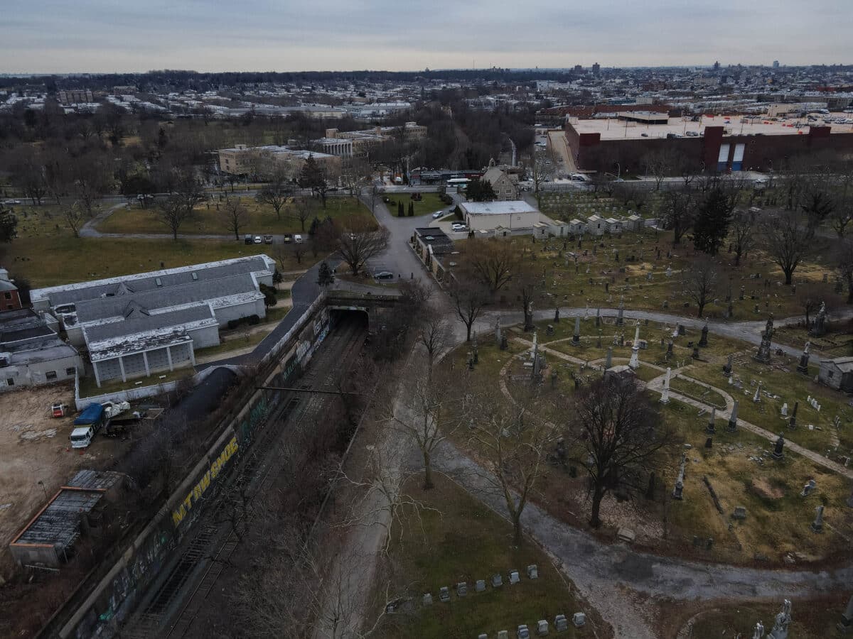 Drone photo of rail right of way near proposed Interborough Express line and All Faiths Cemetery