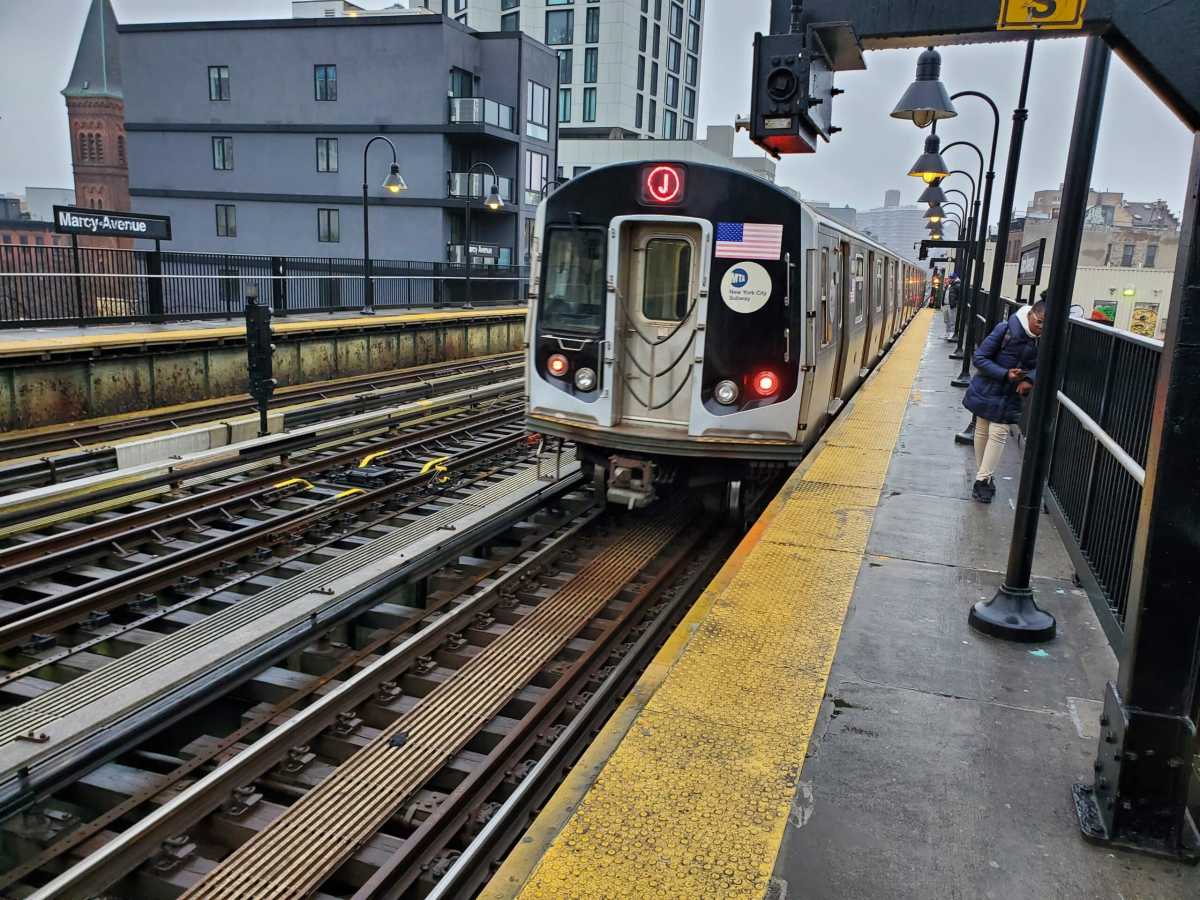 J train departs Marcy Avenue station