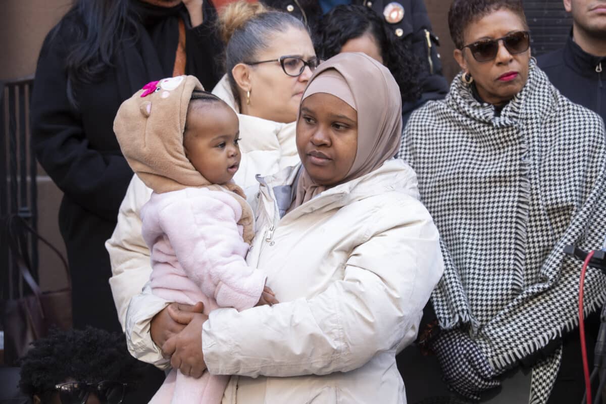 Speaker Adams slams mayor's 60-day shelter limit for migrant families as 'cruel' and 'counterproductive' 4 Migrant mother and child at rally against shelter limit
